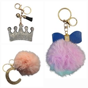 Adorable Bag Charms & Keychains: Pompom, Initial 'C', & Sparkly Crown!
